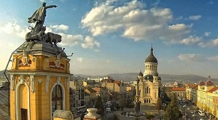 View from the Cluj Romanian National Theatre: statue of revolutionary lawyer Avram Iancu, and the Dormition of the Theotokos Orthodox Cathedral
